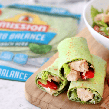 3 caesar salad rolls ups on cutting board