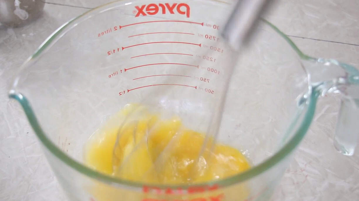 Eggs whisked in large mixing bowl.