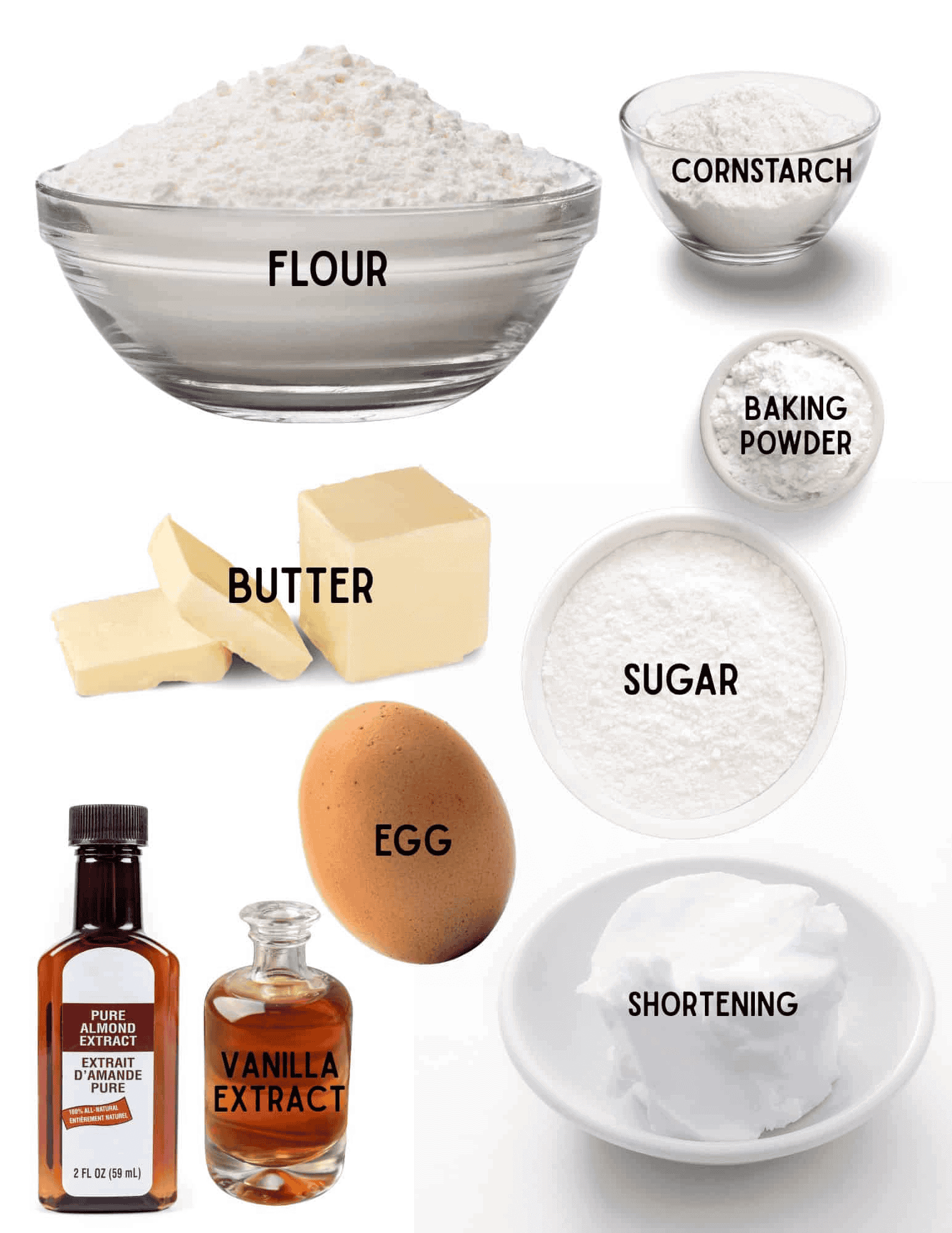 Bowls of flour, cornstarch, baking powder, sugar, shortening, stick of butter, egg, bottles of vanilla extract and almond extract.