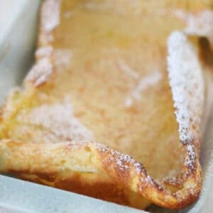 German pancakes in blue baking dish.