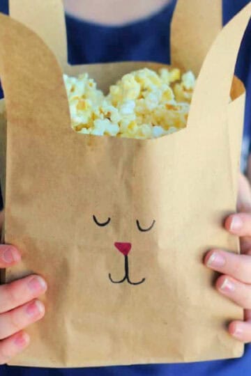 Girl holding brown bunny bag.