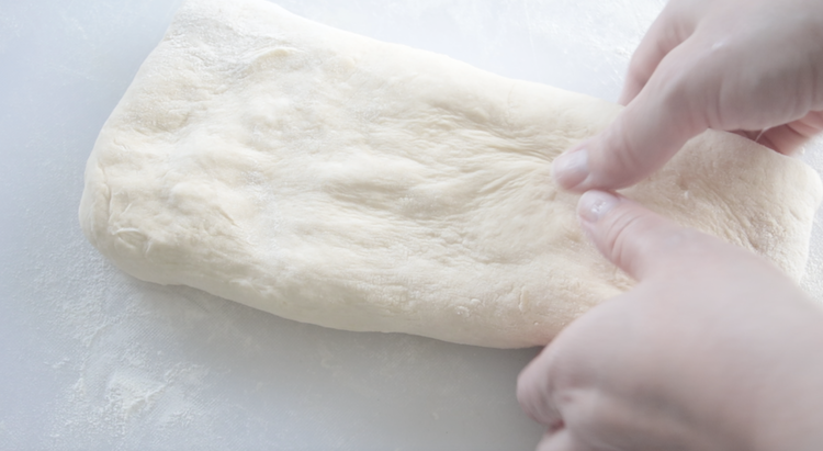 rolled out croissant bread dough