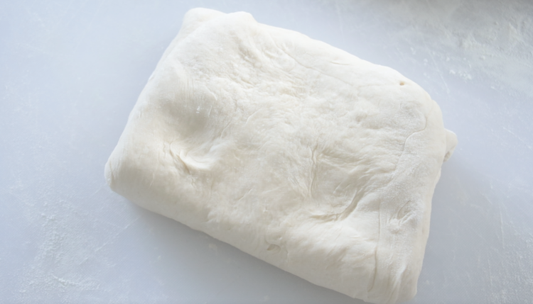 folded dough on work surface
