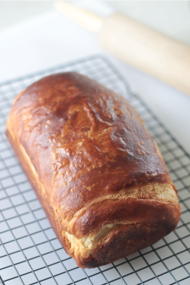 loaf of croissant bread on cooling rack