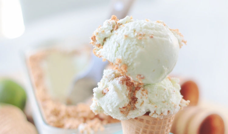 two scoops of lime ice cream in sugar cone
