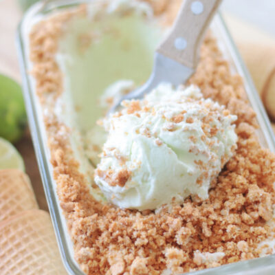 lime ice cream in loaf pan with ice cream scoop