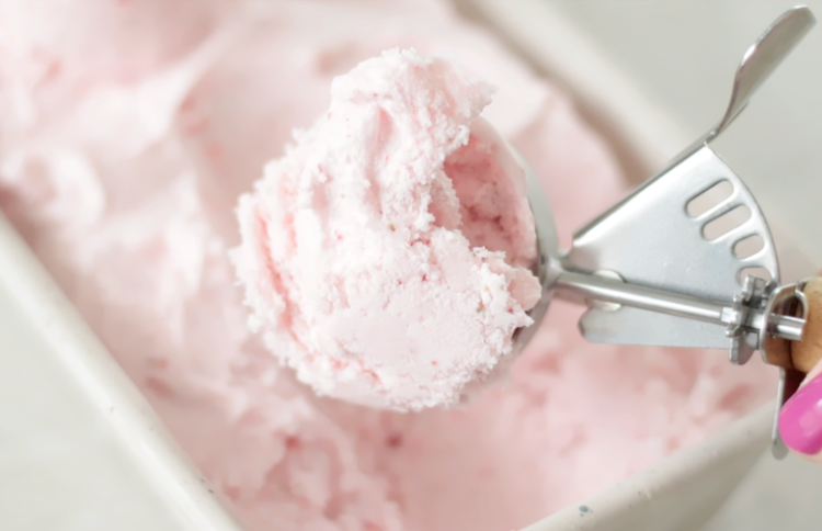 scoop of strawberry ice cream in ice cream scoop