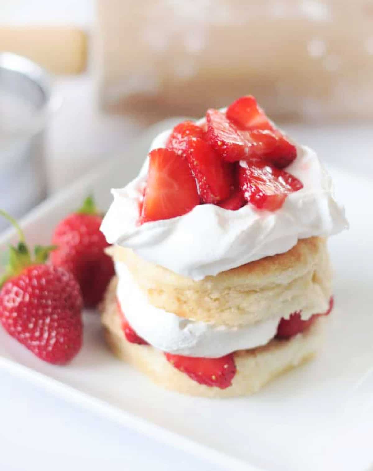 Strawberry shortcake on white plate.