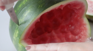 scoring watermelon with knife
