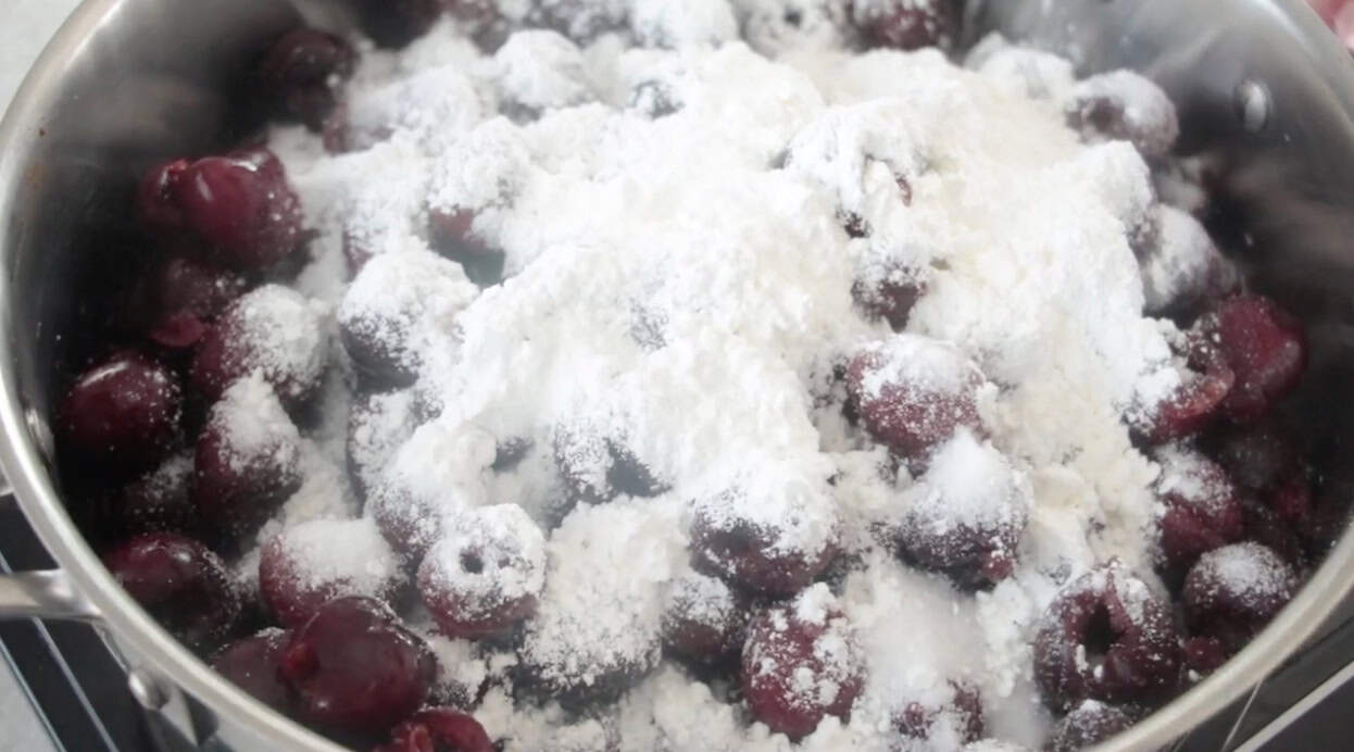 Cherry pie filling ingredients in saucepan.