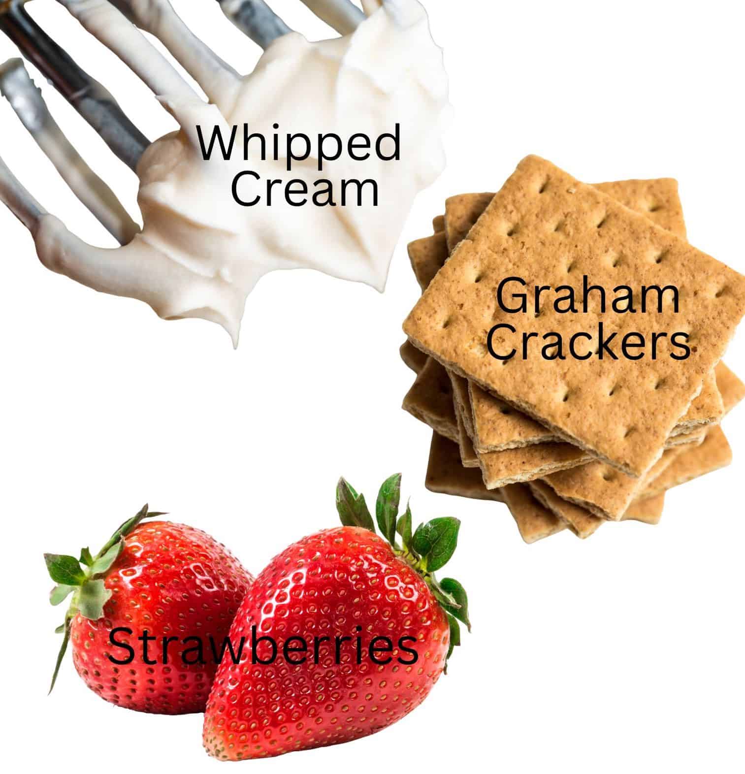 Electric beaters with whipped cream on them, a stack of graham crackers, and fresh strawberries.