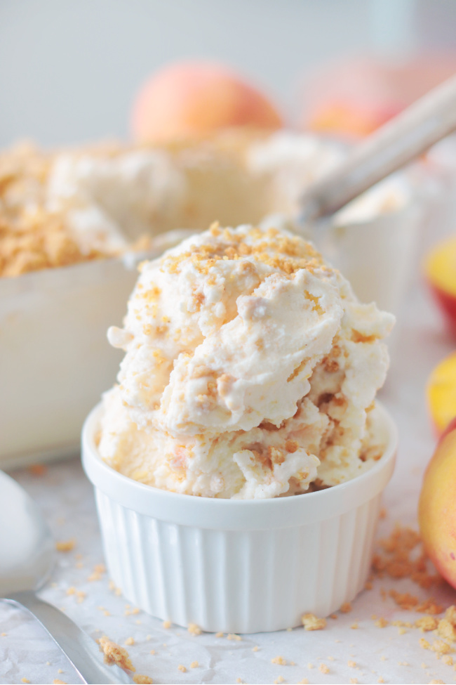 two scoops of peach cobbler ice cream in bowl