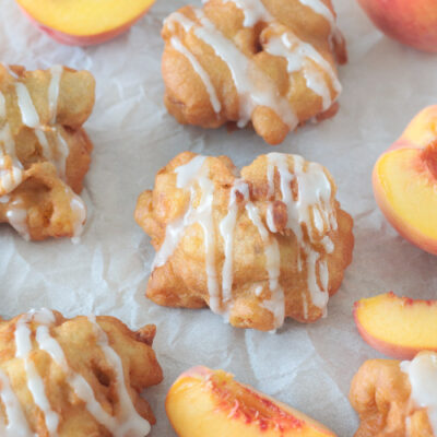 fresh peach fritters drizzled in glaze
