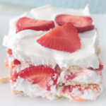 serving of strawberry ice box cake on white plate