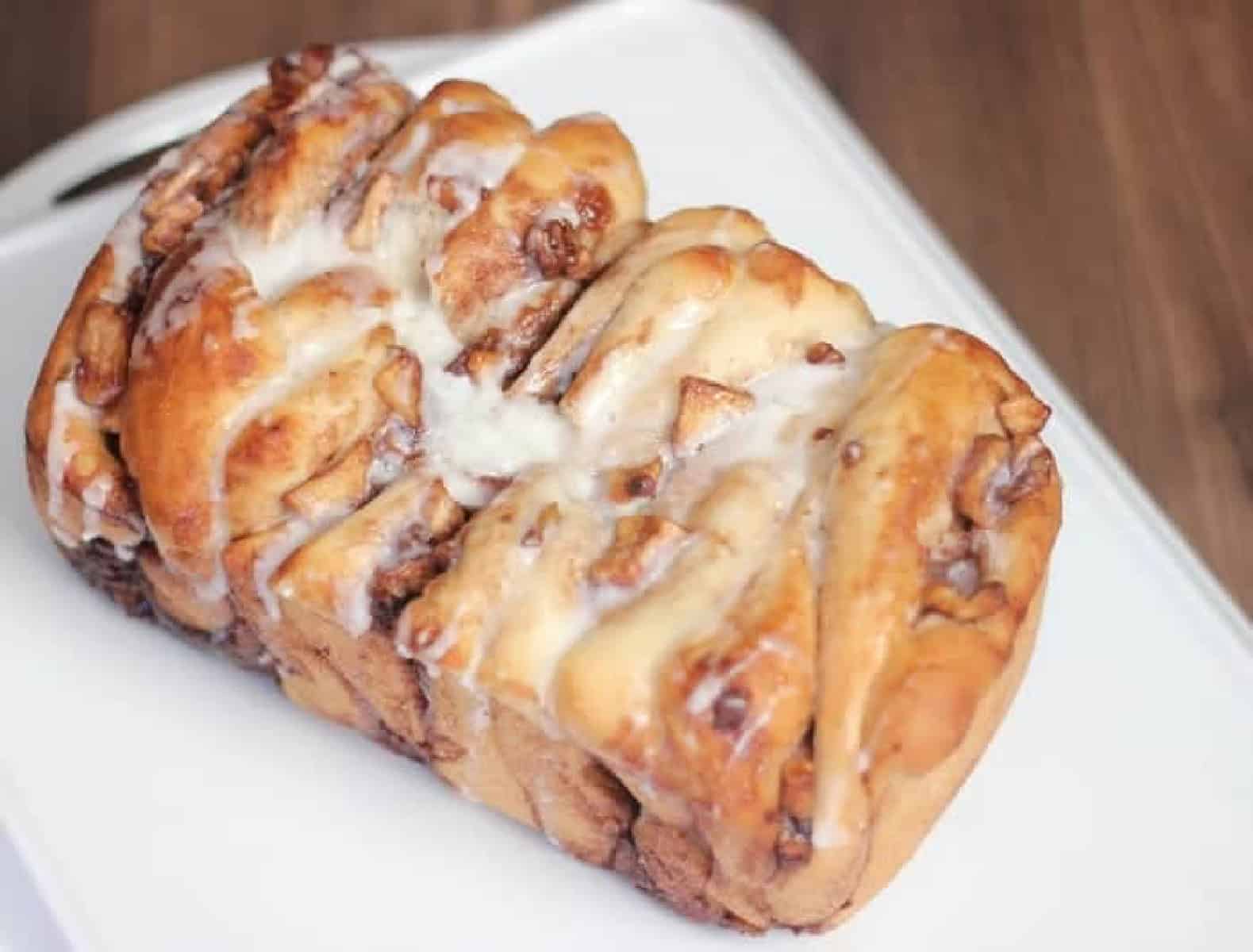 Apple bread on white cutting board.