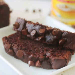 Two slices of chocolate pumpkin bread on a plate.