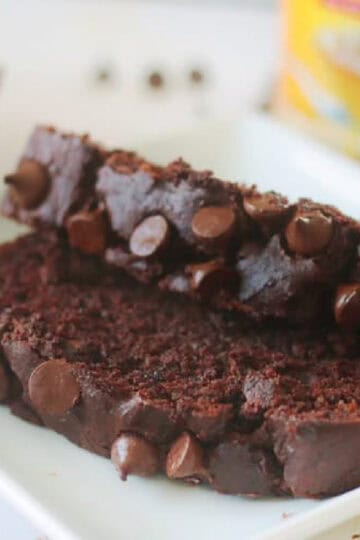 Two slices of chocolate pumpkin bread on a plate.