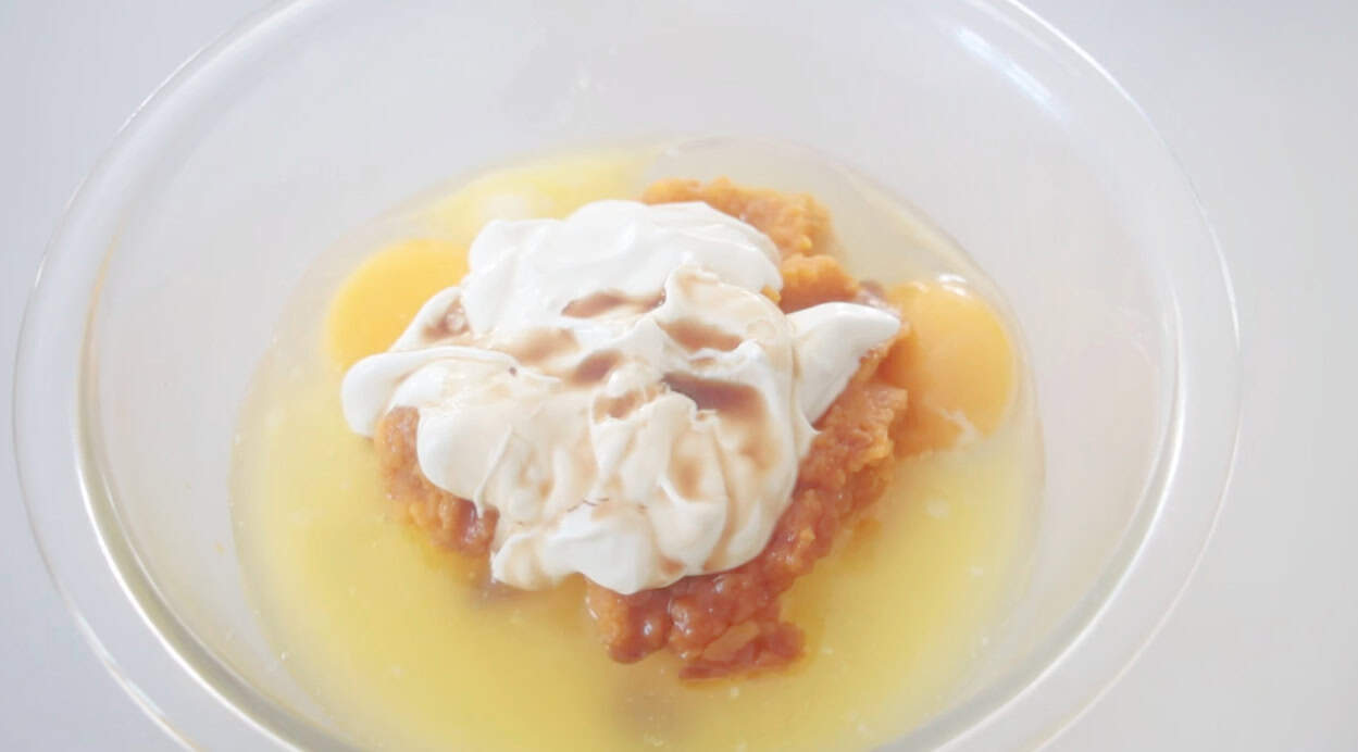 Mixing bowl with melted butter, sour cream pumpkin puree, sugar, vanilla and eggs.