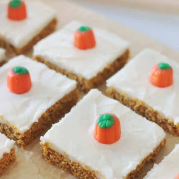 Pumpkin bars frosted and cut into squares.