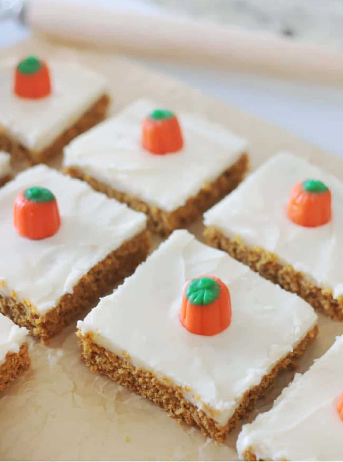 Pumpkin bars frosted and cut into squares.