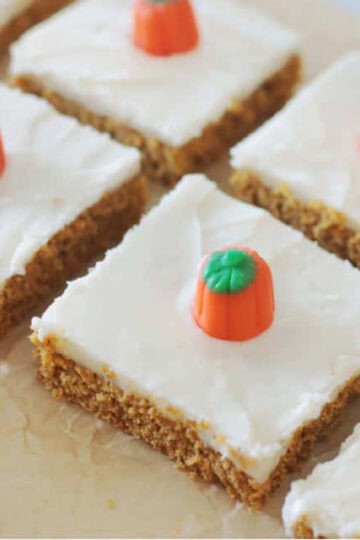 Frosted pumpkin bars cut into squares.
