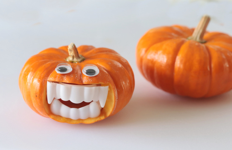 mini pumpkin with white teeth