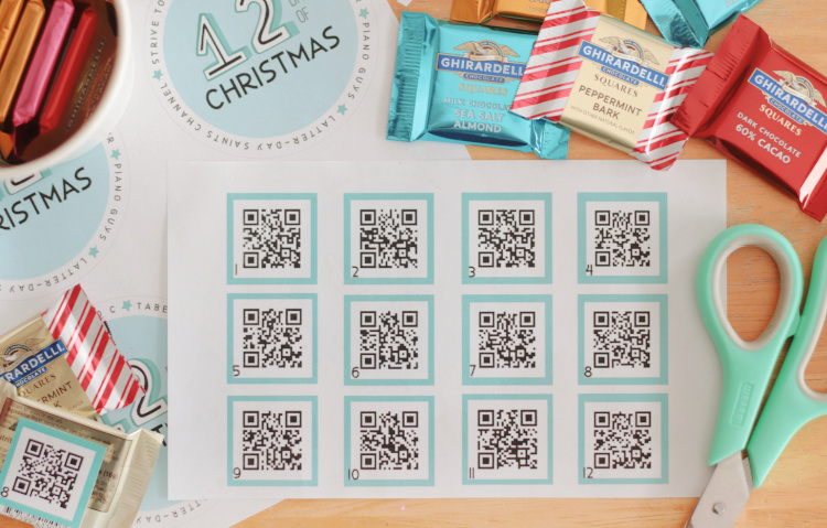 sheet of QR codes, scissors and chocolate candy squares