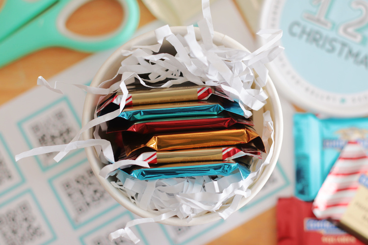 cup of paper shred and chocolate squares