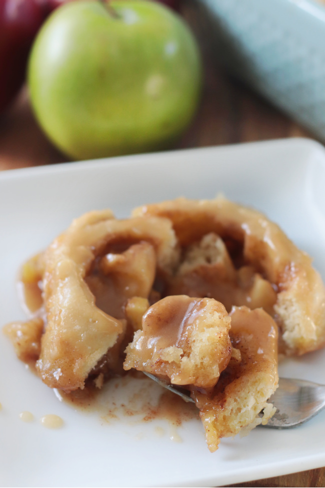 caramel apple cinnamon roll on white plate