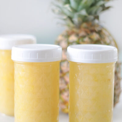 3 jars of pineapple jam with white screw on lids