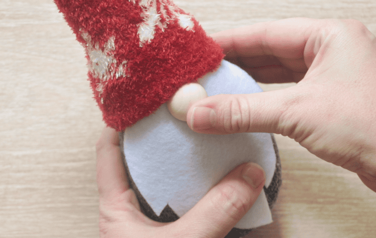 Wooden ball nose glued onto gnome.