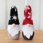 Two sock gnomes on a table.