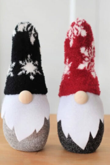 Two sock gnomes on a table.