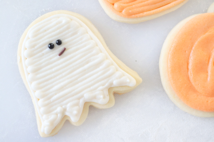 ghost sugar cookie with black candy eyes