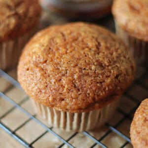 Pumpkin muffin on a cooling rack.