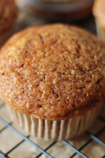 Pumpkin muffin on a cooling rack.