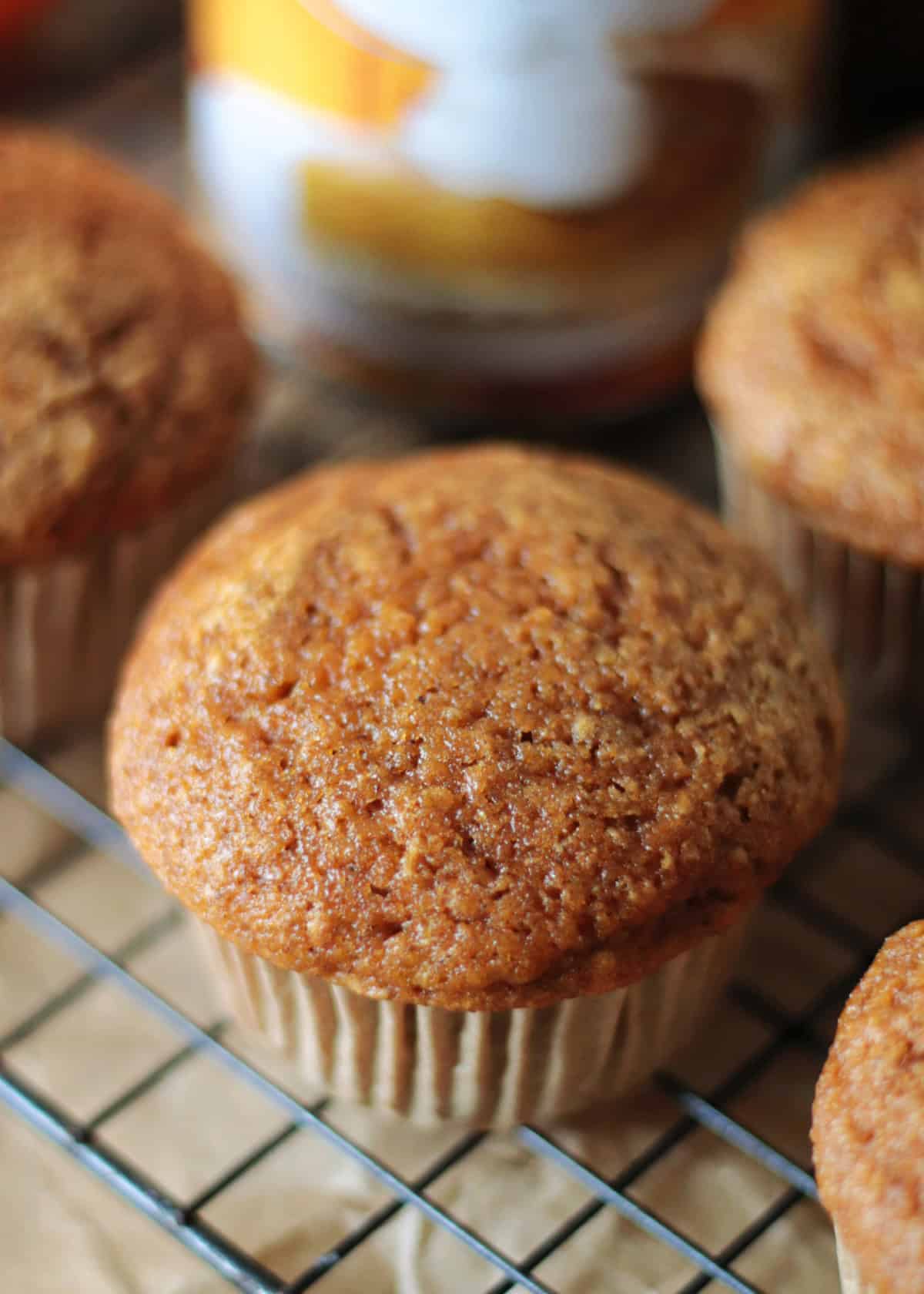 Pumpkin muffins on cooling rack.