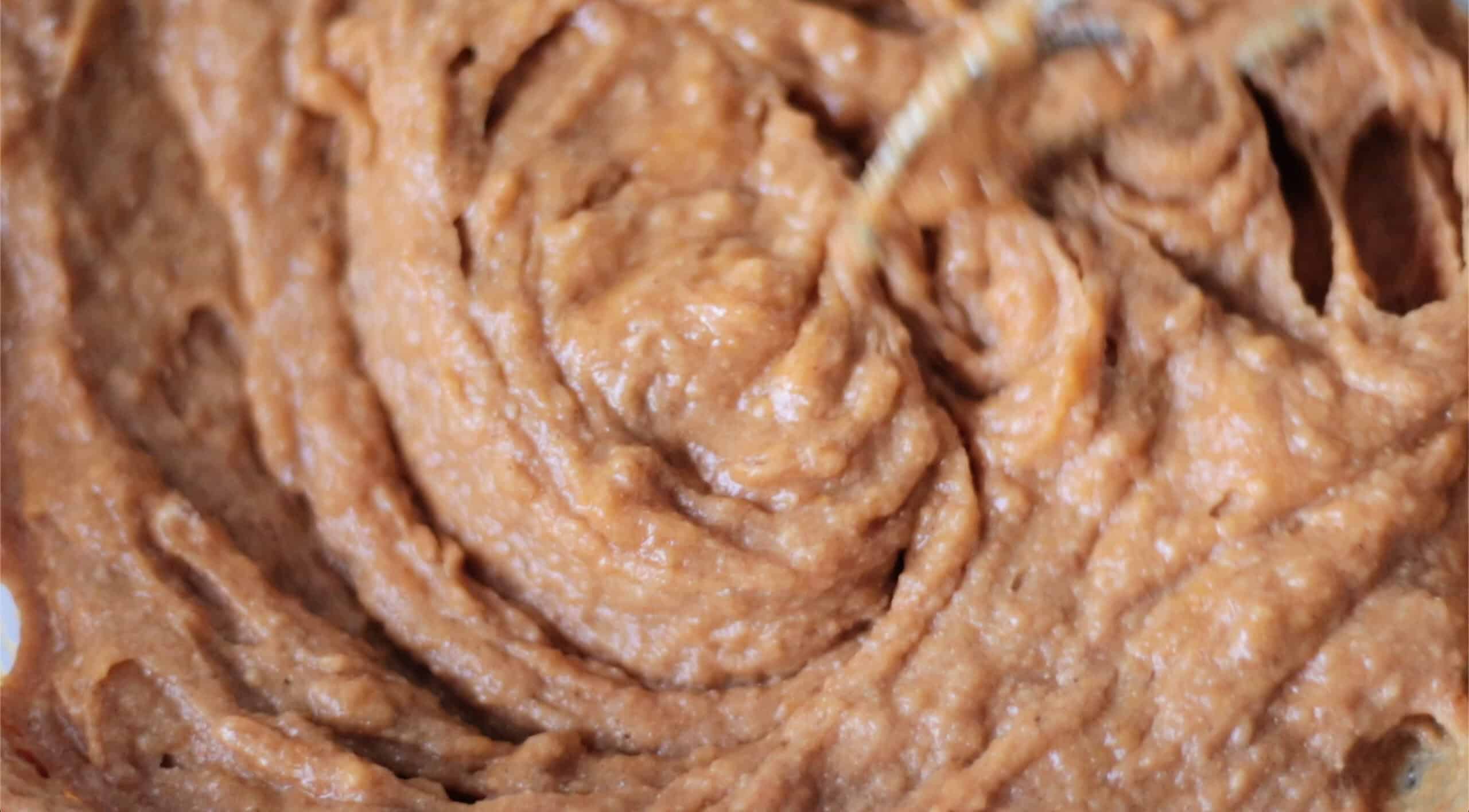 Bowl of pumpkin muffin batter.