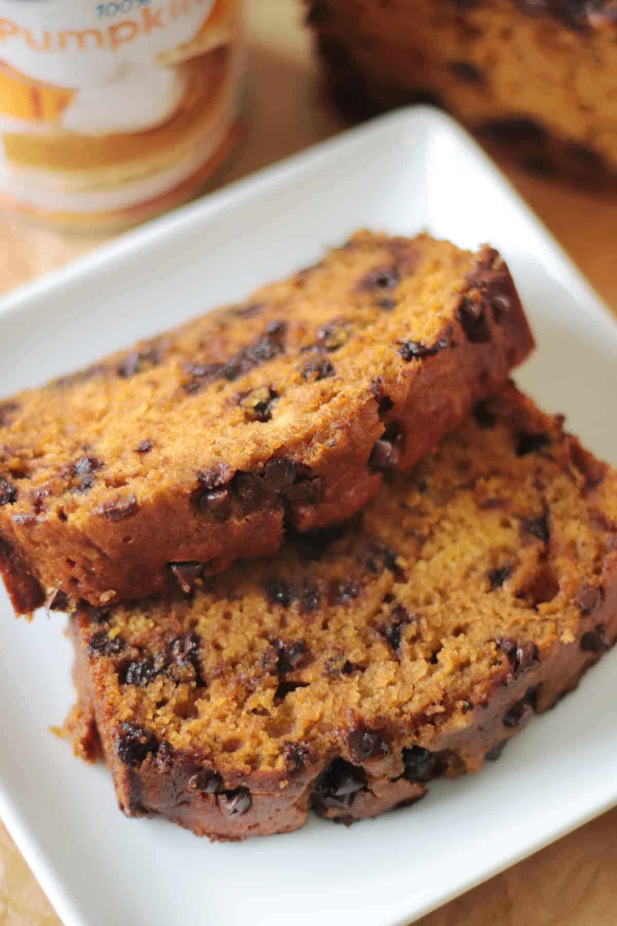 Two slices of pumpkin bread on a white plate.