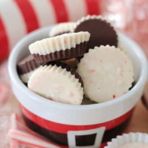 Cup of peppermint bark cups and candy canes.
