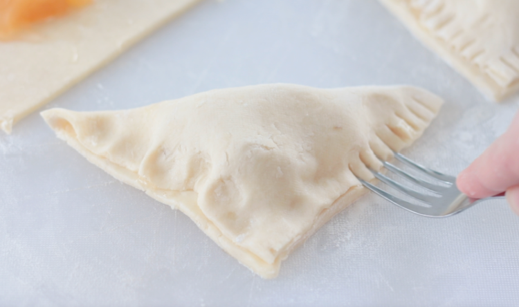 edges of apple turnover crimped with fork