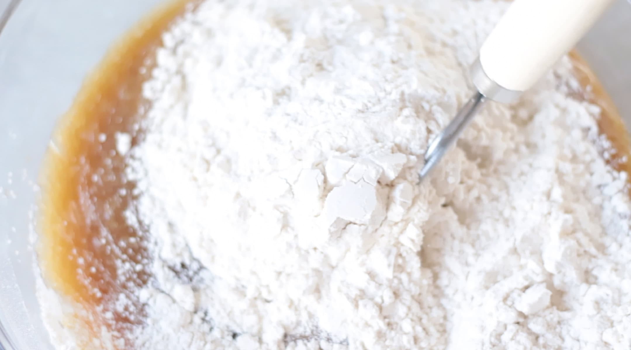 Mixing bowl of cookie dough ingredients.