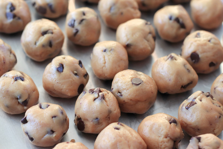 balls of brown butter cookie dough on baking sheet