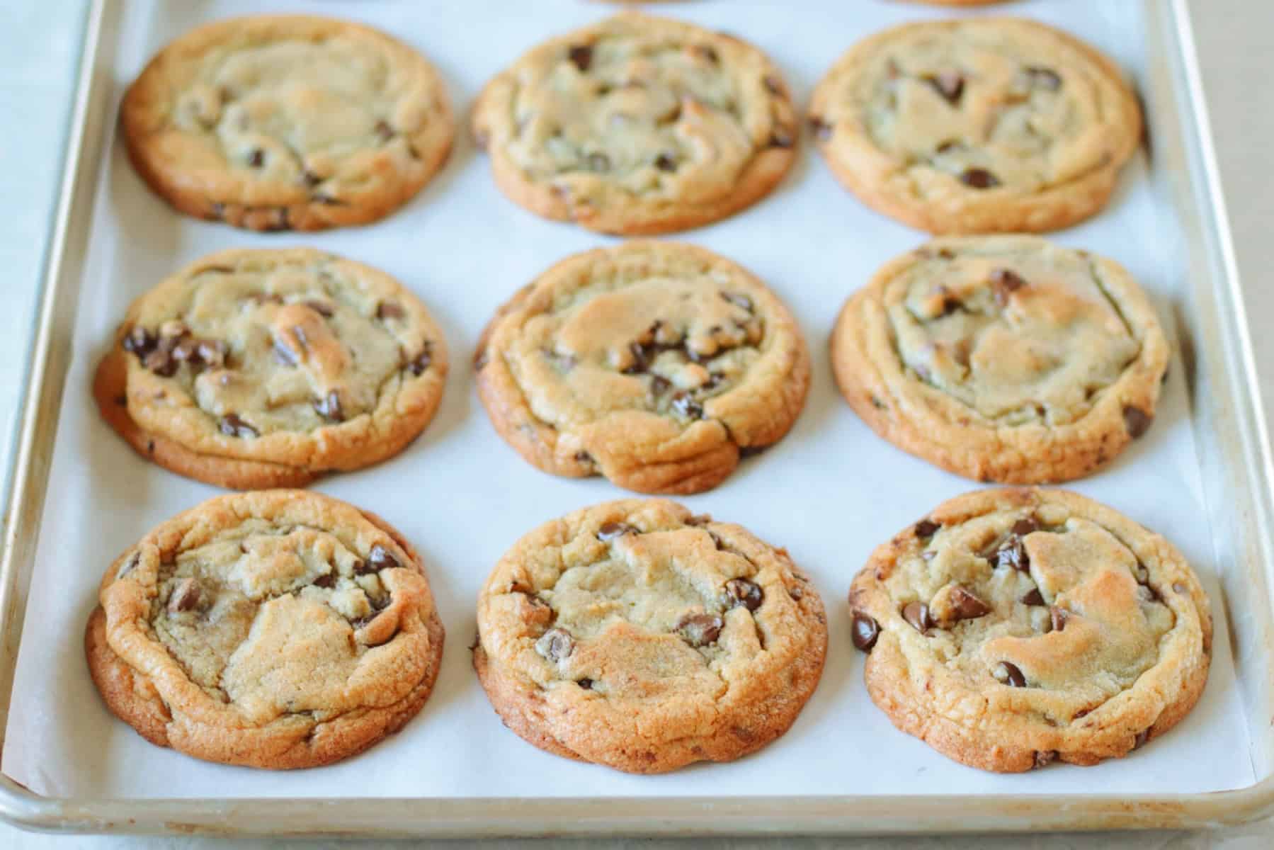 Cookies on a baking sheet lined with parchment paper.
