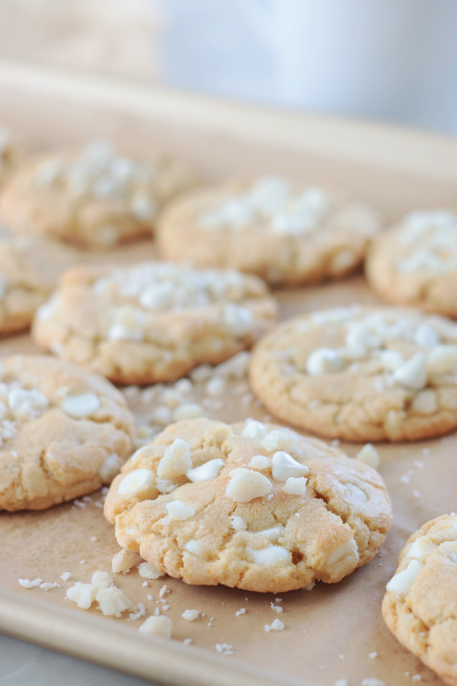 baked brown butter white chocolate cookies on cookie sheet