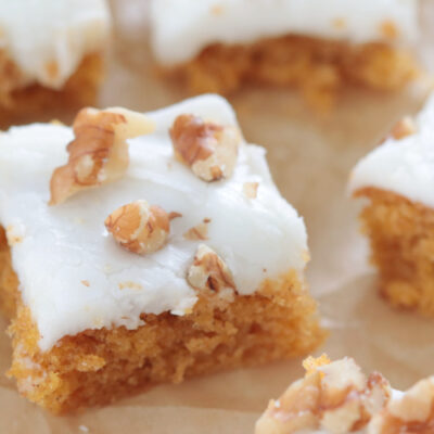 carrot cake bars on parchment paper
