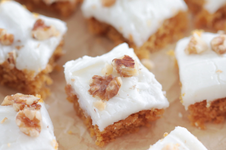 carrot cake bars on parchment paper