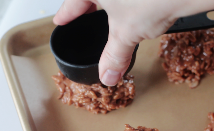 cookies flattened with plastic measuring cup