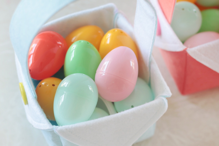 small easter basket filled with plastic eggs