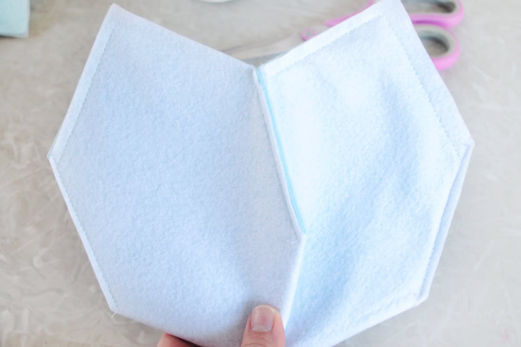 Hand holding inside out easter basket.